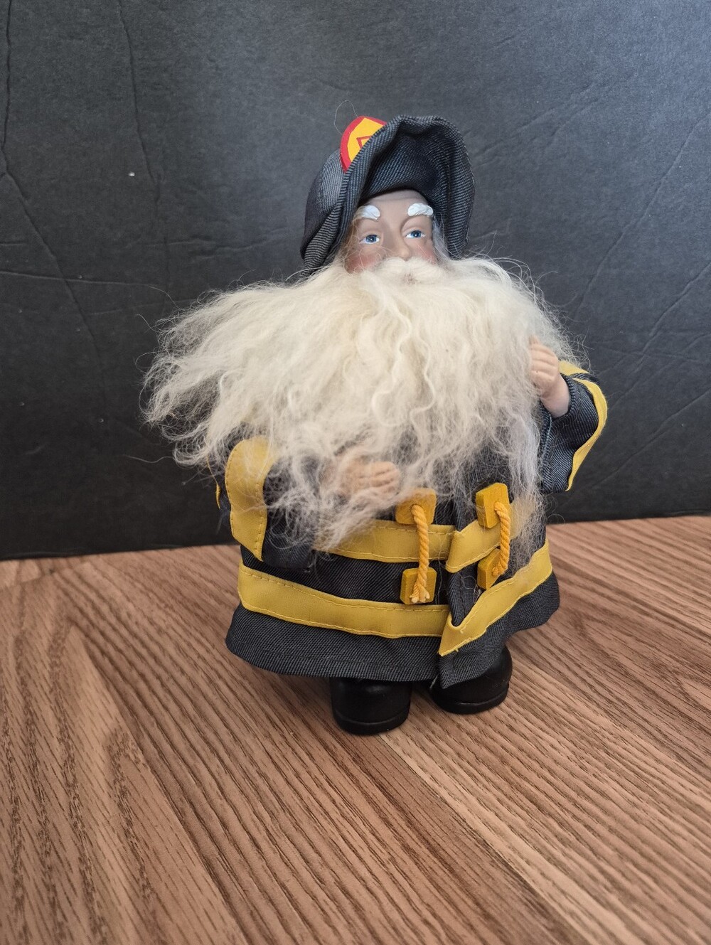 Christmas Santa in Green Firefighter Suit Figurine